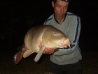 17lbs 3oz carp from tg using bandit baits-    mullberry squid.. a rod length from the bank. a fish known as twisty back.