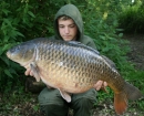 Callum Mcinerney-riley 23lbs 8oz Common Carp from Carthagena Fishery using Nash Bait.. I found a nice silt patch which I had seen fish feeding on but was unable to present a bait on it properly