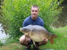 29lbs 0oz Mirror Carp from Sweet Chestnut Lake. stalking by a tree