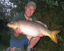 Paul Fletcher 24lbs 8oz Common Carp from Les Burons Carp Fishing using Mainline Fusion.. Caught fishing to far bank reeds (in front of house). Using Century NG Rods, Shimano 6000GTE reels, 15lbs